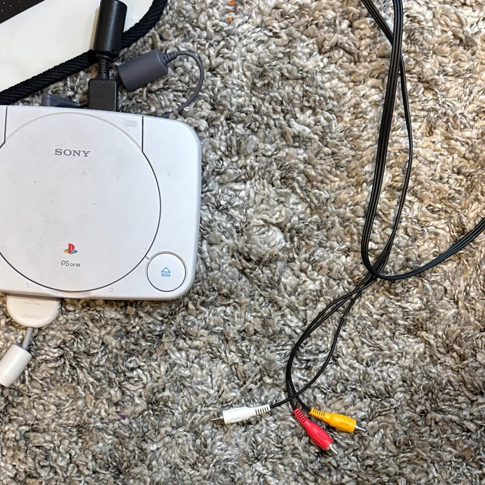 Sony PlayStation Console with White and Gray Design (everything included)